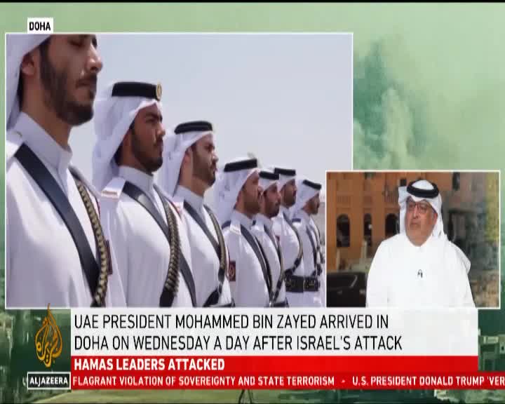 Men in white robes and head coverings stand in a line, their faces serious.  The news ticker on Cape Town TV flashes headlines about a recent attack.

