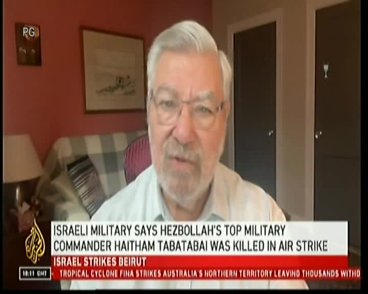 A man with glasses and a white shirt speaks directly into the camera on what appears to be a Cape Town TV broadcast. The lower third of the screen displays news headlines about an Israeli air strike and a tropical cyclone.

