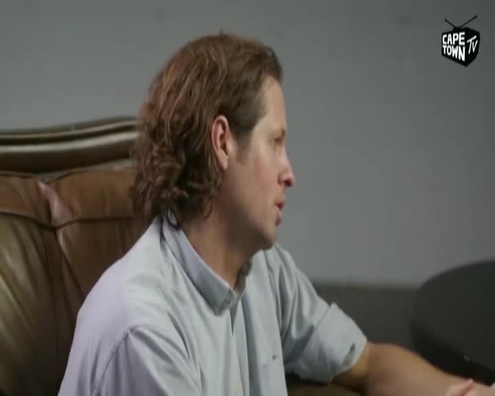 A man with wavy brown hair leans forward, speaking. The Cape Town TV logo is visible in the upper right corner.