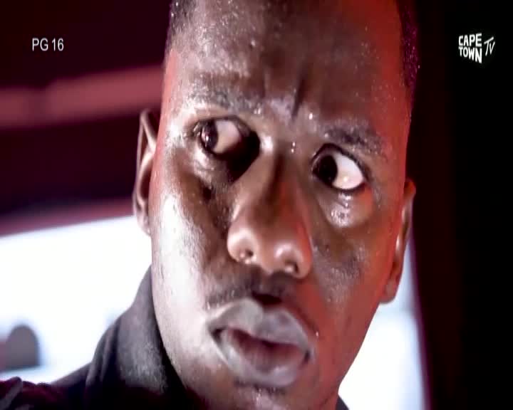 Sweat beads on his forehead as his eyes dart nervously, his breath coming in short gasps. The Cape Town TV logo flickers in the corner, a stark contrast to the tension etched on his face. Sweat beads on his forehead as his eyes dart nervously, his breath coming in short gasps. The Cape Town TV logo flickers in the corner, a stark contrast to the tension etched on his face.