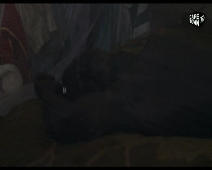 A dark shape, possibly a person, lies on a textured surface. The Cape Town TV logo is visible in the upper right corner. A dark shape, possibly a person, lies on a textured surface. The Cape Town TV logo is visible in the upper right corner.