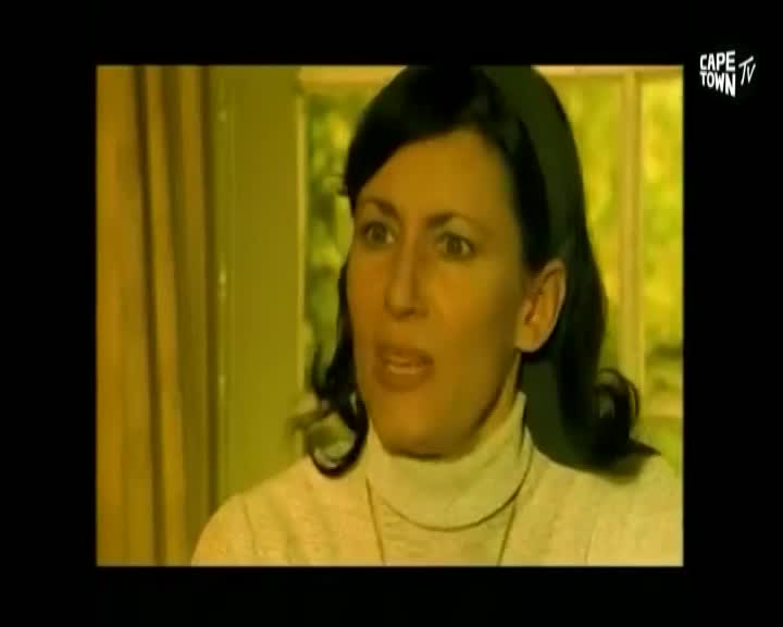 A woman with dark hair, wearing a cream turtleneck, speaks directly to the camera. The Cape Town TV logo is visible in the upper right corner. A woman with dark hair, wearing a cream turtleneck, speaks directly to the camera. The Cape Town TV logo is visible in the upper right corner.
