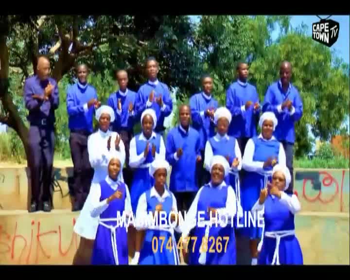 A choir in bright blue uniforms stands on a raised platform, clapping their hands. The Cape Town TV logo appears in the corner of the screen.