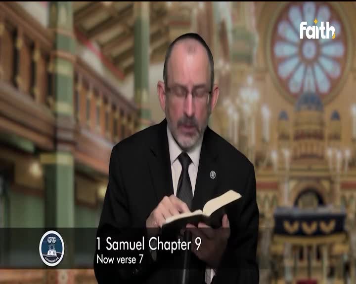 A man in a suit and tie, likely from South Africa, reads from a Bible, his eyes focused on the open pages. The Faith TV logo sits in the top right corner, and a caption below states the chapter and verse.

