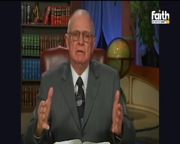 An older gentleman in a suit gestures with his hands while speaking, a bible open before him. The Faith TV logo is visible in the corner, a familiar sight on South African screens. An older gentleman in a suit gestures with his hands while speaking, a bible open before him. The Faith TV logo is visible in the corner, a familiar sight on South African screens.