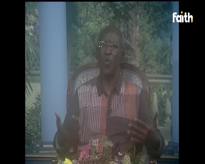 A man in a patterned shirt speaks with his hands animated, his glasses reflecting the light. The Faith TV logo appears in the corner of the screen, a familiar sight in South Africa. A man in a patterned shirt speaks with his hands animated, his glasses reflecting the light. The Faith TV logo appears in the corner of the screen, a familiar sight in South Africa.