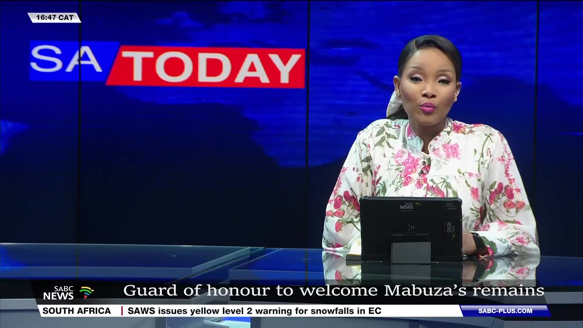 A woman in a floral blouse speaks directly to the camera, framed by the "SA Today" logo on a blue background. Below, the SABC News banner scrolls with headlines about South Africa.
