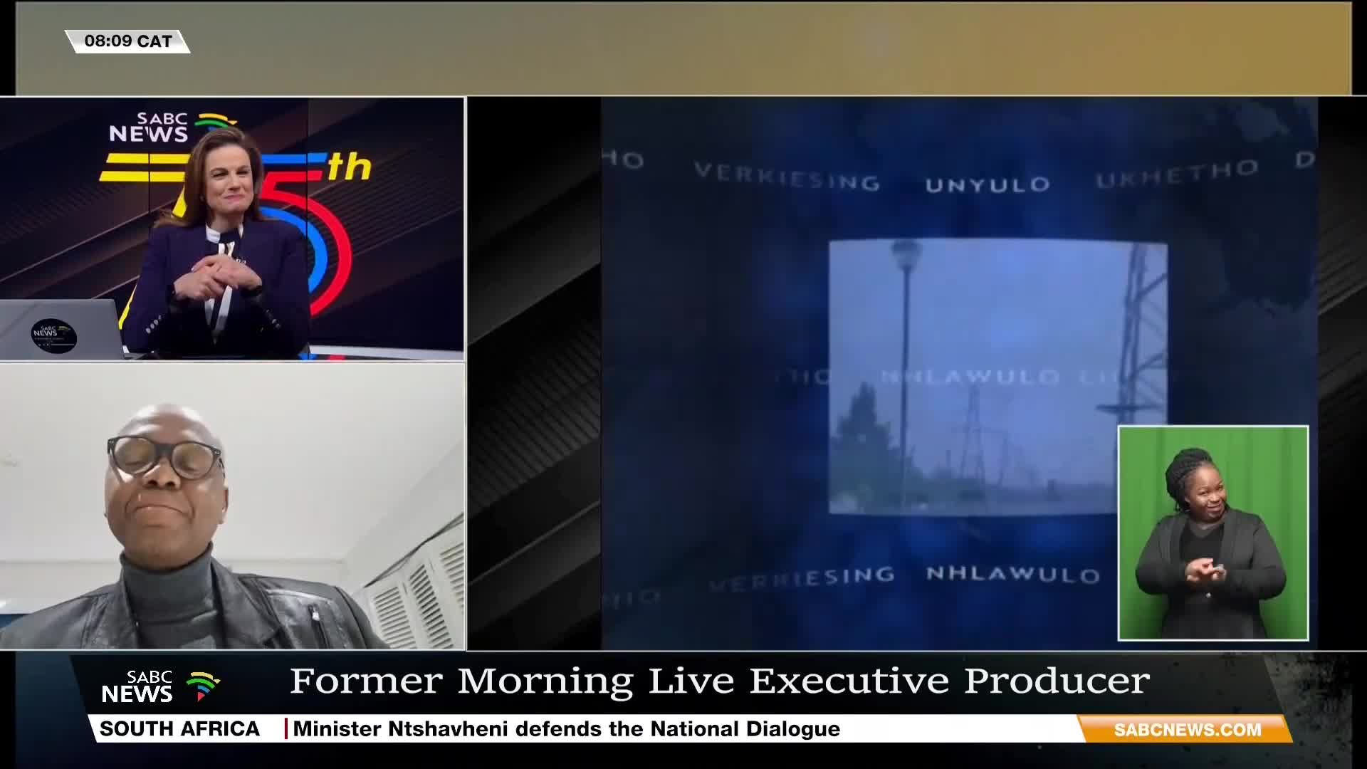 A panel discussion on SABC News is underway, with a former Morning Live executive producer speaking. The broadcast includes a sign language interpreter and a screen showing a cloudy outdoor scene.
