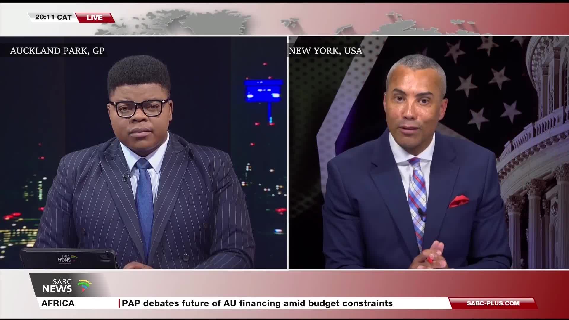 From Auckland Park, the SABC News anchor is looking directly at the camera. Across the screen, a man in New York is speaking, his hands gesturing as he talks.
