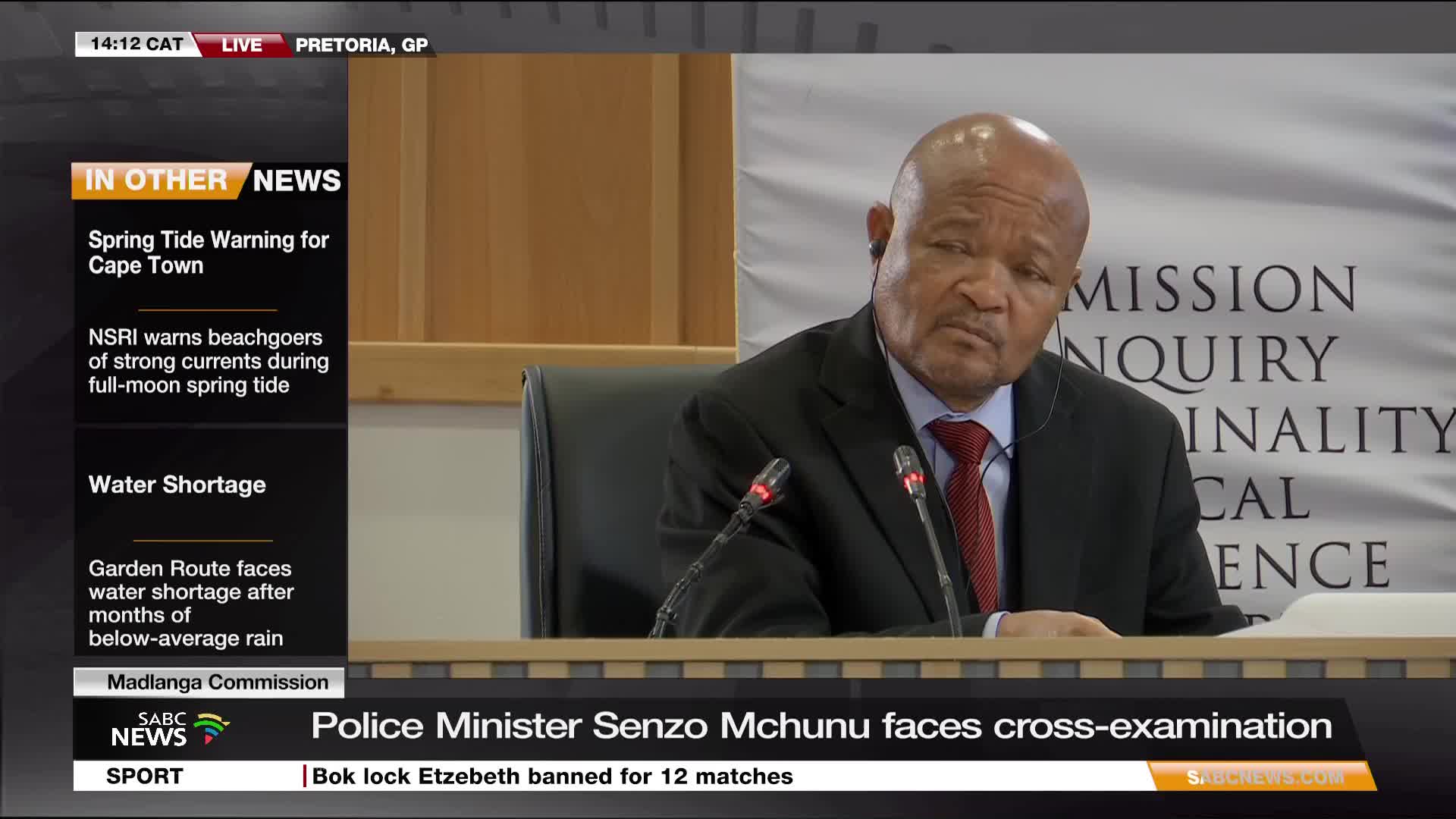 The Police Minister, Senzo Mchunu, sits at a table, looking intently ahead with a microphone in front of him. SABC News is broadcasting live from Pretoria, where he's facing cross-examination.
The Police Minister, Senzo Mchunu, sits at a table, looking intently ahead with a microphone in front of him. SABC News is broadcasting live from Pretoria, where he's facing cross-examination.