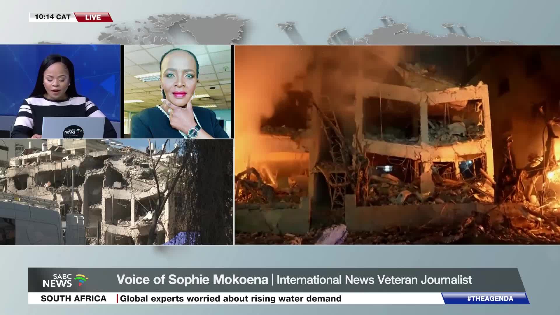 Flames erupt from a damaged building, illuminating the debris scattered across the ground. A news anchor on SABC News is speaking, her face framed by the live broadcast. Flames erupt from a damaged building, illuminating the debris scattered across the ground. A news anchor on SABC News is speaking, her face framed by the live broadcast.