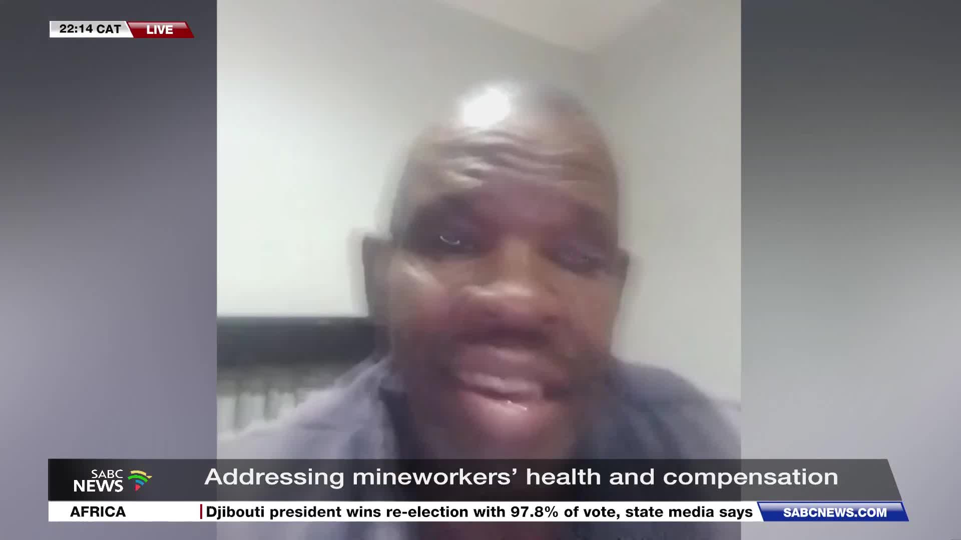 The SABC News broadcast is live at 22:14 CAT, featuring a man speaking about mineworkers' health and compensation. A ticker at the bottom of the screen reports on an election in Djibouti.
