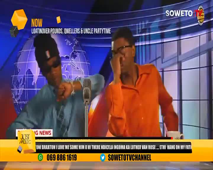 On Soweto TV, a man in a blue shirt throws a fist, while the other, in orange, covers his face. The background is a globe, and the "Just Music" banner is lit up.
