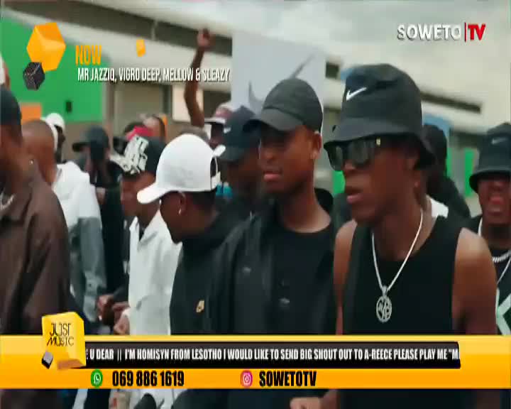 A crowd of people, many wearing caps, move forward, some with their hands raised. The Soweto TV logo is visible, and the screen displays information about Mr. Jazziq, Vigro Deep, Mellow & Sleazy.
