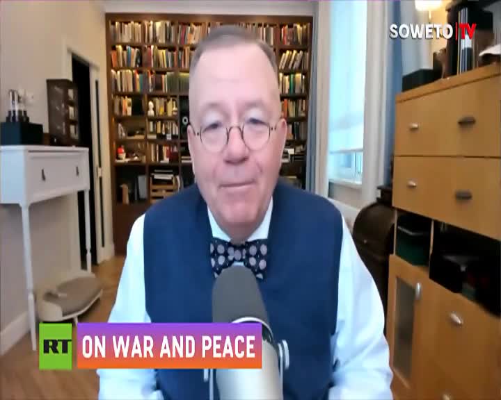 A man in a vest and bowtie speaks into a microphone. The Soweto TV logo appears in the upper right corner. A man in a vest and bowtie speaks into a microphone. The Soweto TV logo appears in the upper right corner.