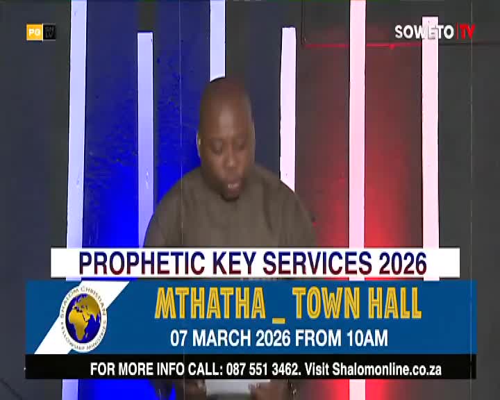 A man in a brown shirt stands before a backdrop of tall, illuminated pillars. Text on the screen announces "Prophetic Key Services 2026" and details an event at the Mthatha Town Hall on March 7, 2026. A man in a brown shirt stands before a backdrop of tall, illuminated pillars. Text on the screen announces "Prophetic Key Services 2026" and details an event at the Mthatha Town Hall on March 7, 2026.