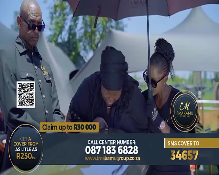 A man in a dark jacket stands stoically, while two women under an umbrella lean over a table, one signing a document. The Soweto TV broadcast overlays the scene with contact information for iMakamu Funerals.