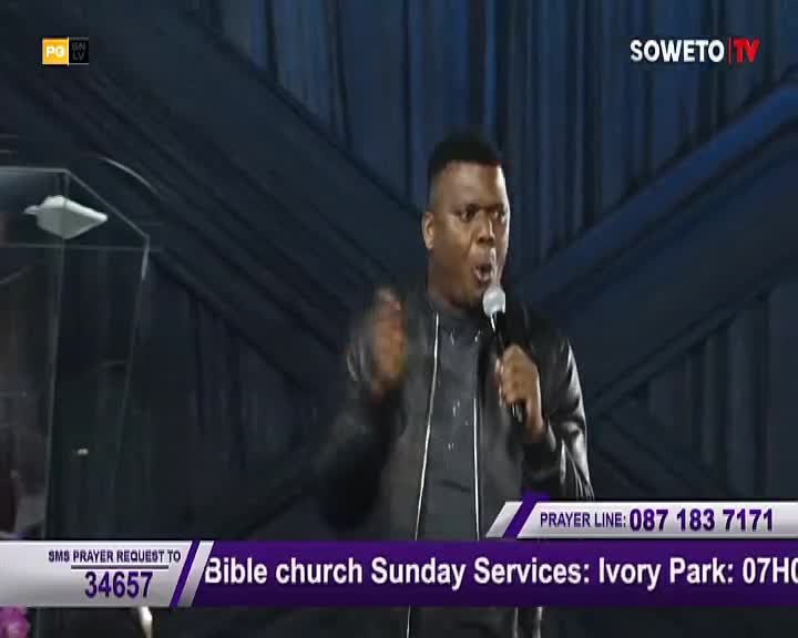 A man speaks into a microphone, his hands raised in emphasis, on a Soweto TV broadcast. The screen displays details for Bible church Sunday Services in Ivory Park.