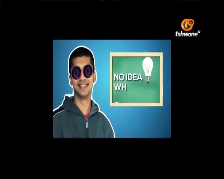 A young man with swirly purple glasses grins at the camera, a chalkboard behind him displaying "NO IDEA WH" and a lightbulb. The Tshwane TV logo appears in the corner. A young man with swirly purple glasses grins at the camera, a chalkboard behind him displaying "NO IDEA WH" and a lightbulb. The Tshwane TV logo appears in the corner.