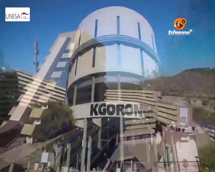 The Tshwane TV logo is visible in the sky above a large, curved building with "KGORONG" written across it. The UNISA logo appears in the upper left corner. The Tshwane TV logo is visible in the sky above a large, curved building with "KGORONG" written across it. The UNISA logo appears in the upper left corner.