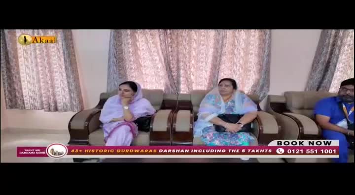 Three people are seated on a sofa, facing the camera. The Akaal Channel logo is visible in the corner, and a banner at the bottom promotes "Historic Gurdwara Darshan."
