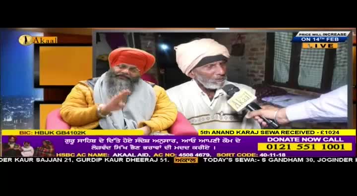 A man in a turban is speaking into a microphone held by another person. The Akaal Channel logo is visible on the microphone.