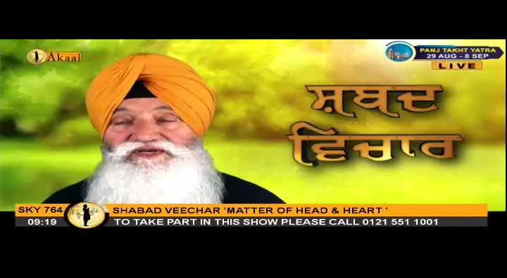 A man with a long white beard and an orange turban speaks on Akaal Channel. Golden Punjabi script fills the screen behind him.