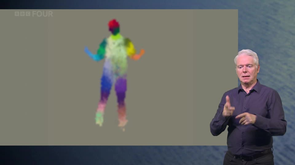 On the BBC Four screen, a figure made of shifting colours dances. Beside it, a man signs with his hands.