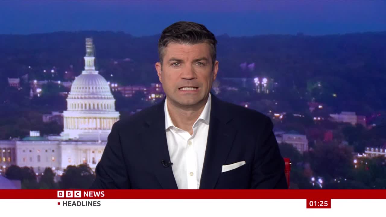 A man in a dark suit is speaking directly to the camera, his expression serious. Behind him, the US Capitol building is visible, suggesting a story from Washington, DC, on BBC News.
