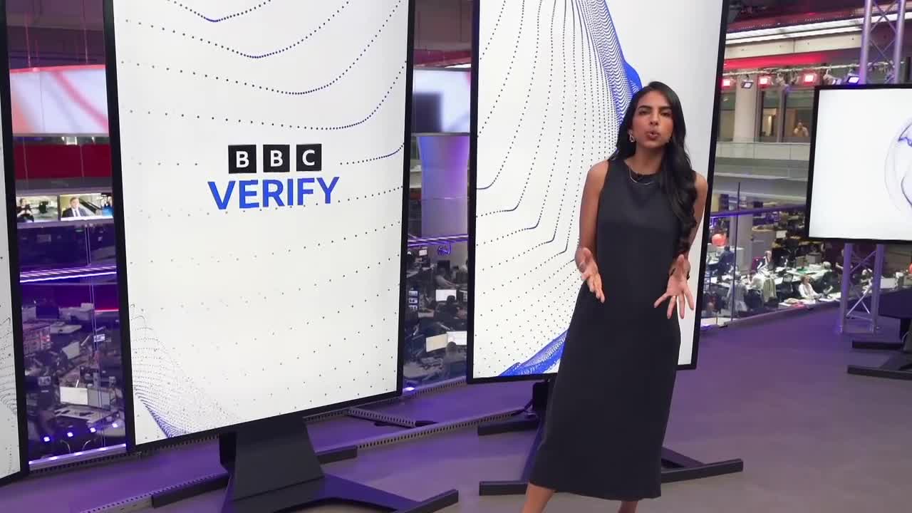 A woman in a black dress gestures with her hands as she speaks in front of large screens. The BBC Verify logo is prominently displayed on one of the monitors.
A woman in a black dress gestures with her hands as she speaks in front of large screens. The BBC Verify logo is prominently displayed on one of the monitors.