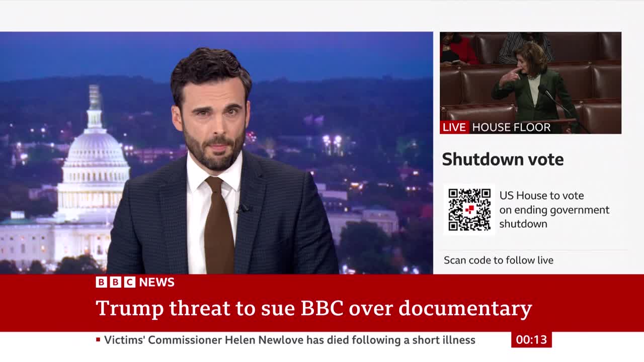 A BBC News anchor in a dark suit speaks directly to the camera, with the US Capitol building visible behind him. A live feed from the House floor shows a person gesturing, with text about a government shutdown vote.
A BBC News anchor in a dark suit speaks directly to the camera, with the US Capitol building visible behind him. A live feed from the House floor shows a person gesturing, with text about a government shutdown vote.