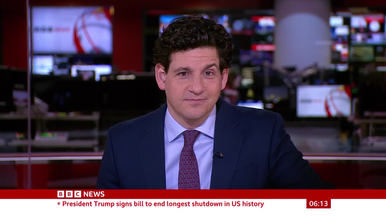 A man in a navy suit and patterned tie is looking directly at the camera. The BBC News logo is visible at the bottom of the screen, with a headline about President Trump.
A man in a navy suit and patterned tie is looking directly at the camera. The BBC News logo is visible at the bottom of the screen, with a headline about President Trump.