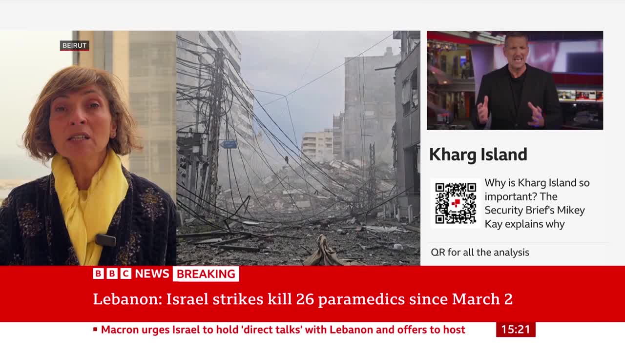 A woman in a yellow scarf speaks from Beirut, while a scene of destruction unfolds behind her. The BBC News ticker reports on strikes in Lebanon, with a separate segment discussing Kharg Island.