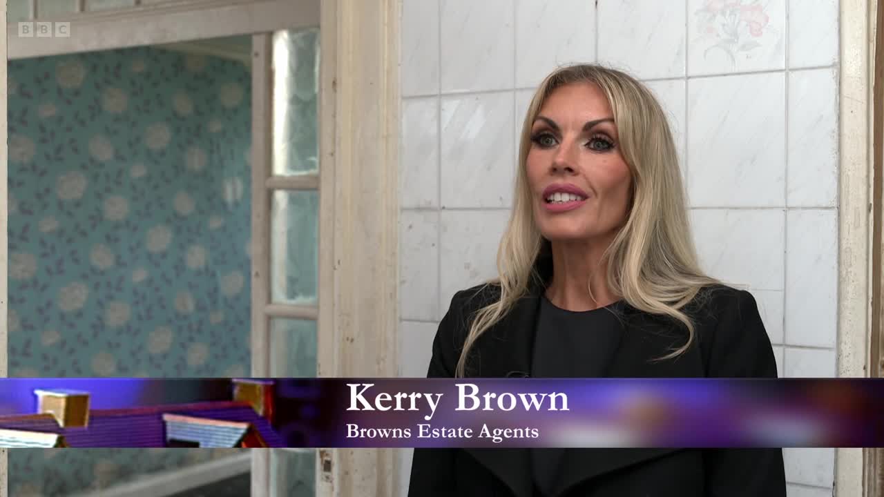 Kerry Brown, from Browns Estate Agents, is speaking, framed against a backdrop of old, tiled walls. Behind her, a glimpse of a room with patterned wallpaper is visible.
