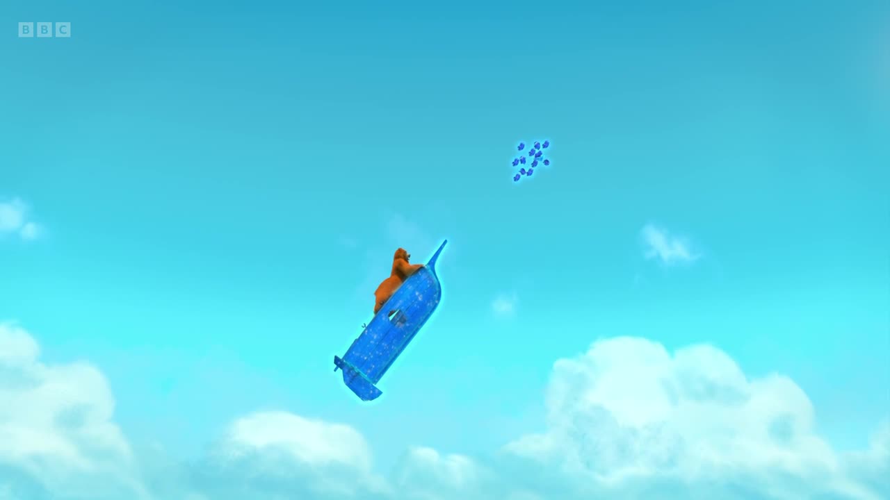A cartoon bear is riding a blue, boat-shaped vehicle high in the sky. A cluster of small blue shapes floats nearby against a bright blue background.
