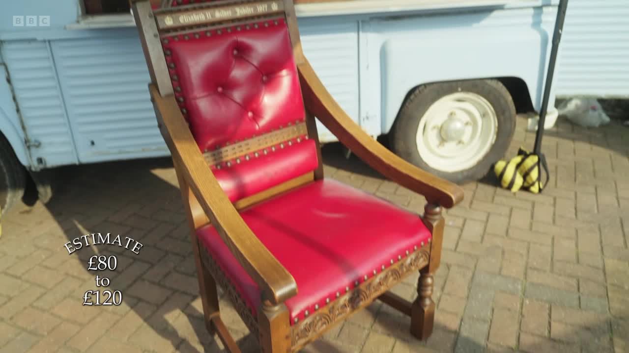 A red leather chair sits on a brick surface, with an estimate of £80 to £120 displayed on screen. Behind it, a light blue van is parked, and a BBC Two logo is visible in the top left corner.
