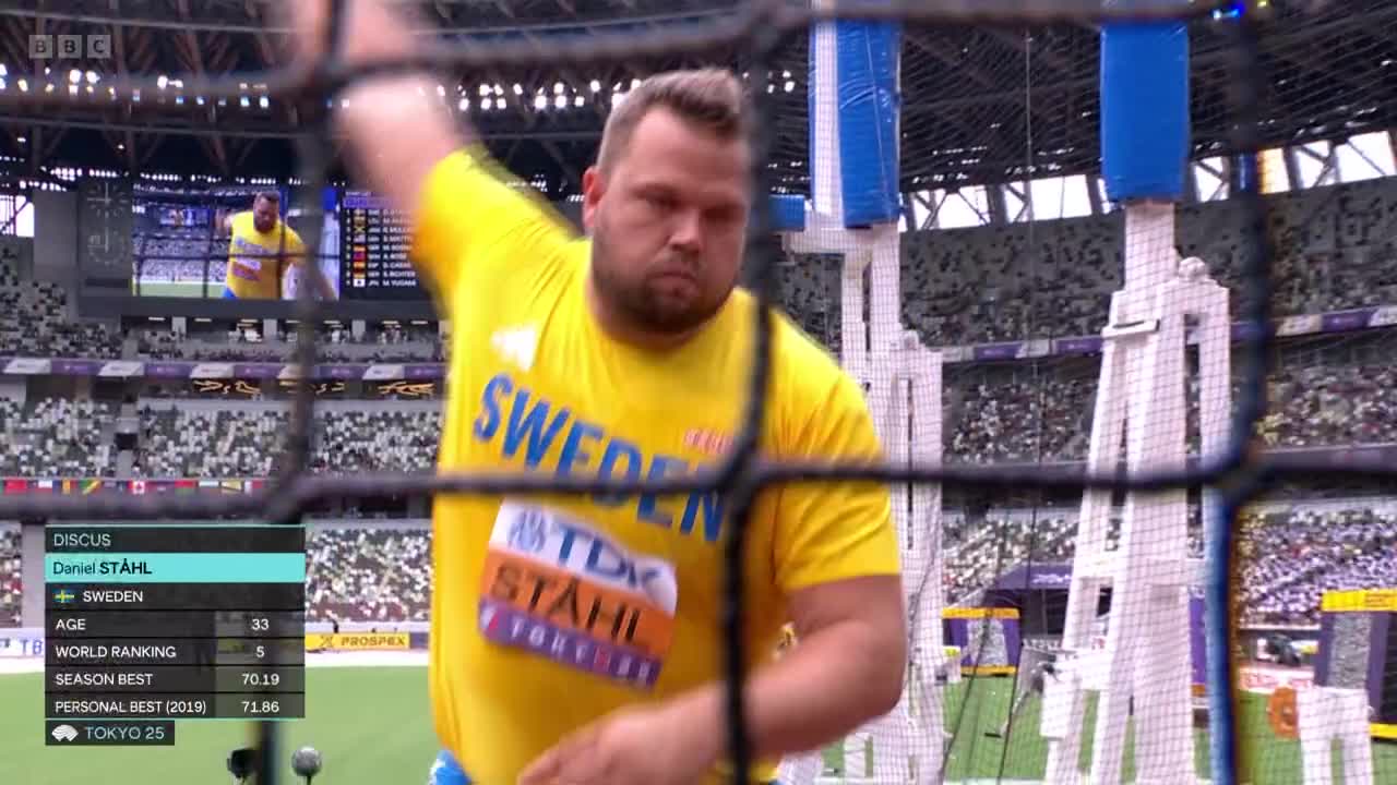 Daniel Stahl, in a yellow Sweden shirt, is mid-throw, the discus still unseen. The stadium is packed, and the BBC Two graphics show his details.
