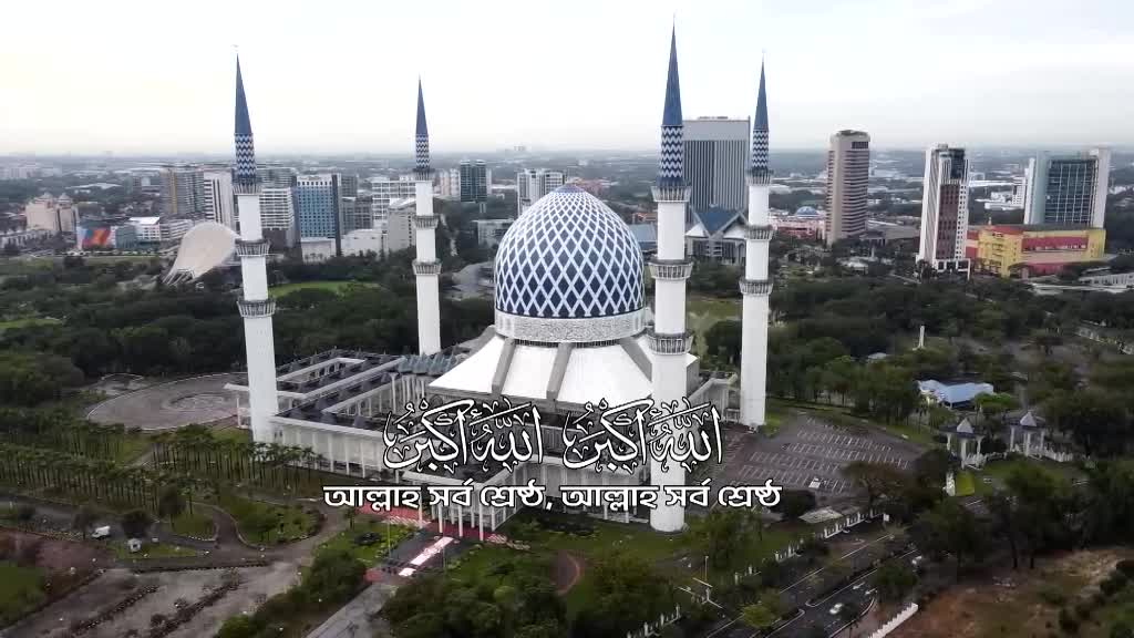 A large mosque with a blue and white dome and tall minarets dominates the scene, set against a backdrop of a modern city. The image, likely from Deen TV, features Arabic script overlaid on the foreground.
