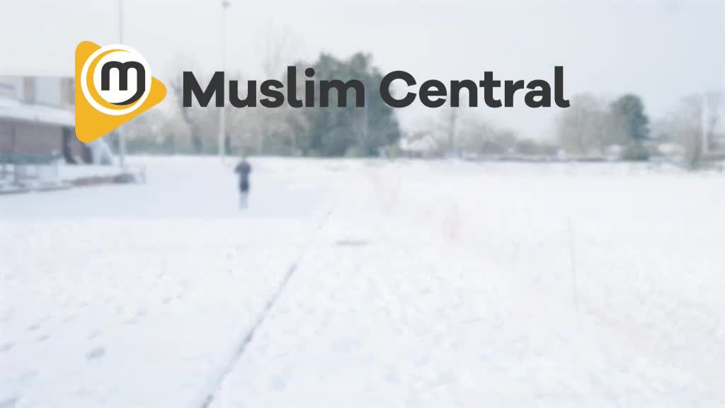 A lone figure trudges through the snow-covered field. The logo for Muslim Central is displayed, likely indicating a broadcast from the United Kingdom's Eman Channel.
