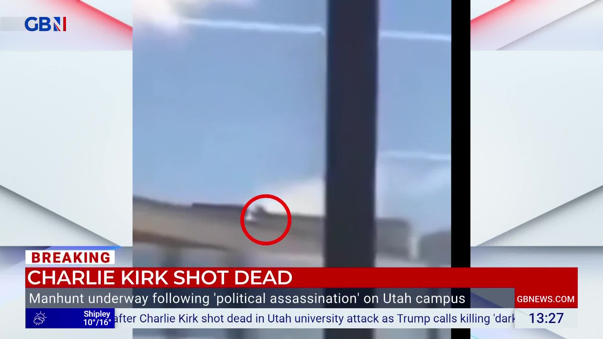 A small figure is visible on a rooftop, circled in red on the GB News screen. The breaking news banner states a manhunt is underway following a "political assassination" on a Utah campus.
