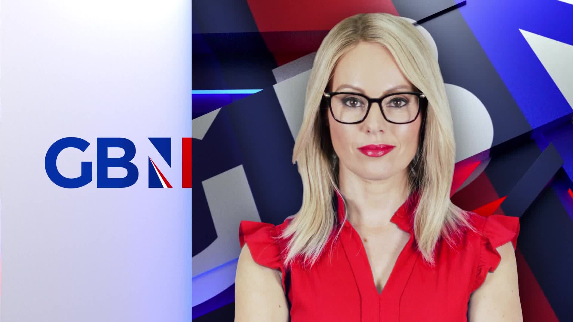 A woman in a red top and glasses looks directly at the camera against a backdrop of blue, white, and red shapes, with the GB News logo to the left. She's framed, ready to speak.
