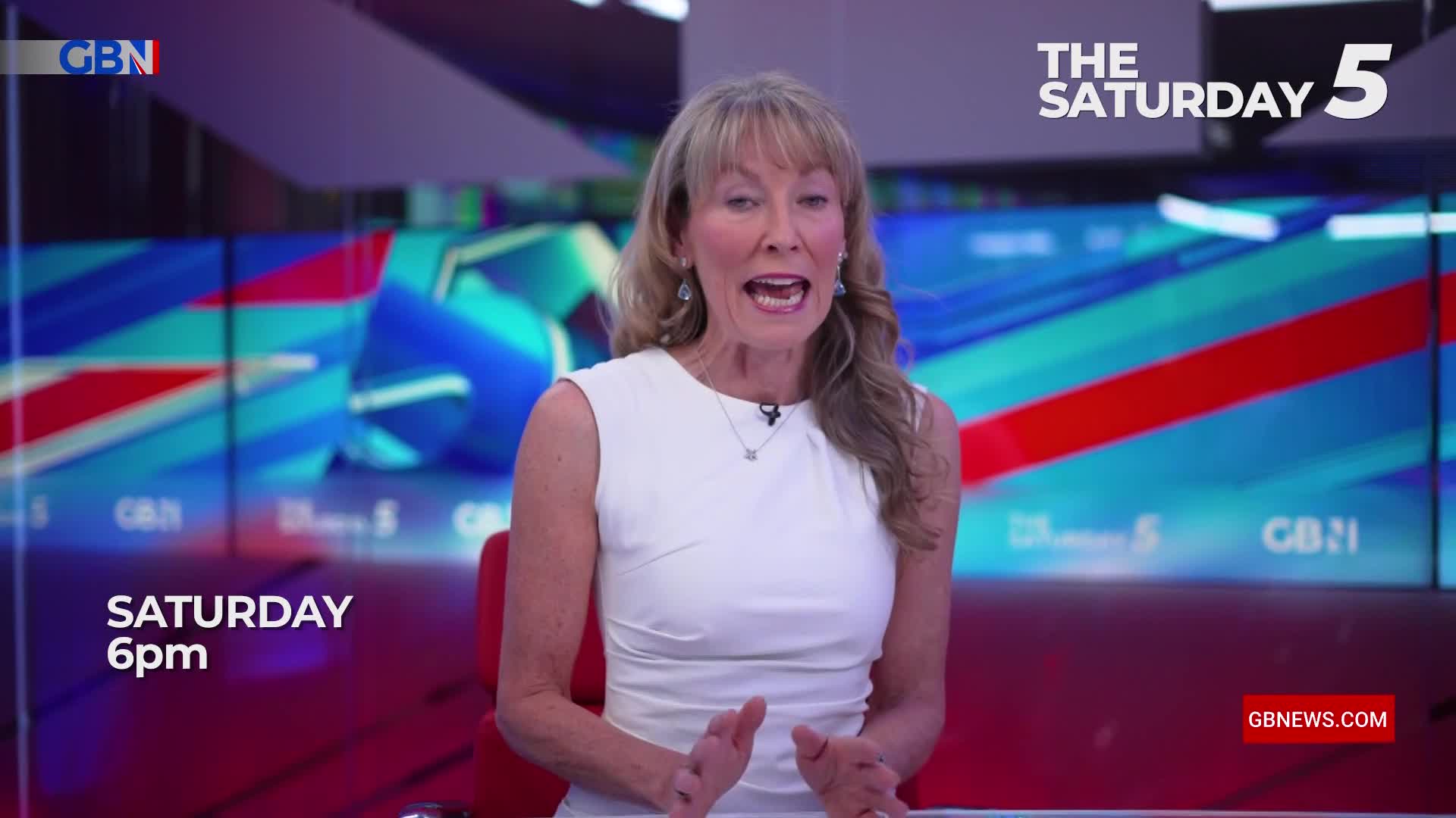 A woman in a white dress gestures animatedly, her mouth open as she speaks. The GB News logo and "The Saturday 5" are visible, along with a backdrop of red, white, and blue.
