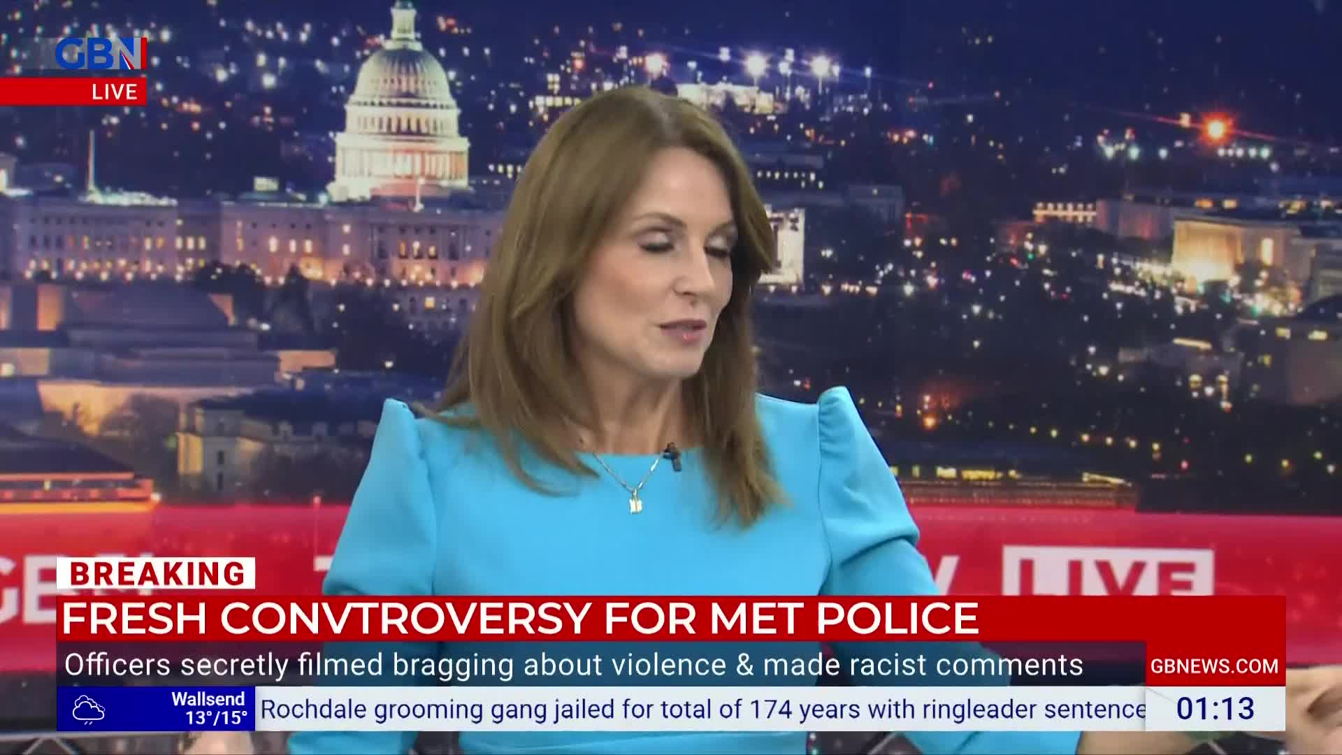 A woman in a blue dress speaks, her gaze directed slightly downward. Below, a GB News headline flashes about the Met Police and a recent controversy.
