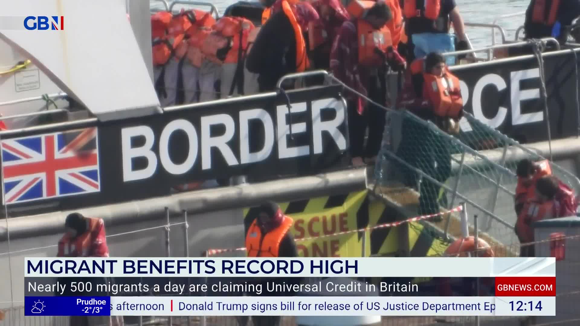 A boat marked "BORDER" with the Union Jack flag is crowded with people wearing orange life jackets. GB News is reporting on the scene, with a headline about migrant benefits in Britain.
