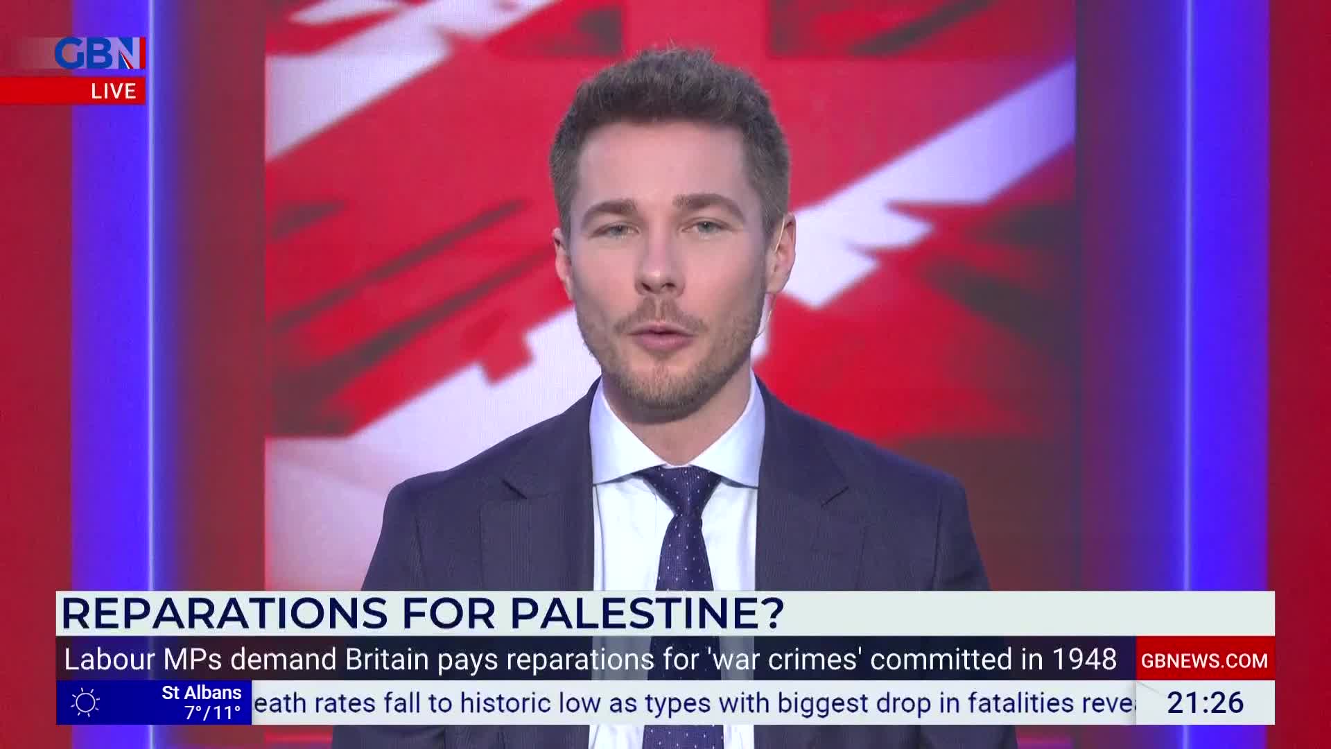 A man in a suit and tie speaks directly to the camera, with the GB News logo visible in the corner. A headline scrolls across the bottom of the screen, reading "REPARATIONS FOR PALESTINE?"