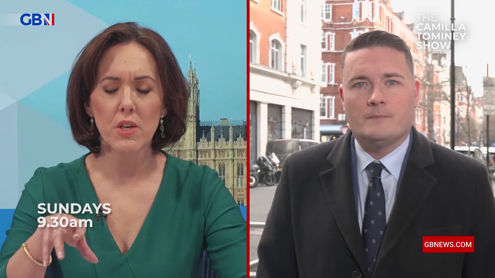 A woman in a green dress speaks animatedly, gesturing with her hand. Beside her, a man in a dark coat stands on a London street, looking directly ahead.