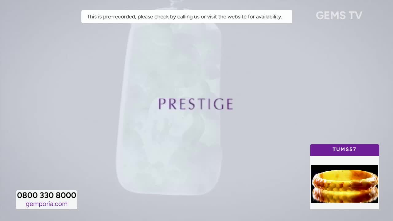 A large, pale gemstone pendant is displayed with the word "PRESTIGE" overlaid. The Gems TV logo and a number for a ring are visible in the corner, along with contact information for the United Kingdom.
