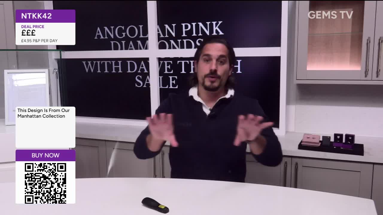 Dave, on Gems TV, gestures with both hands, as if to emphasize a point about the Angolan Pink Diamonds sale. A QR code and price details for the item are displayed on the screen.
