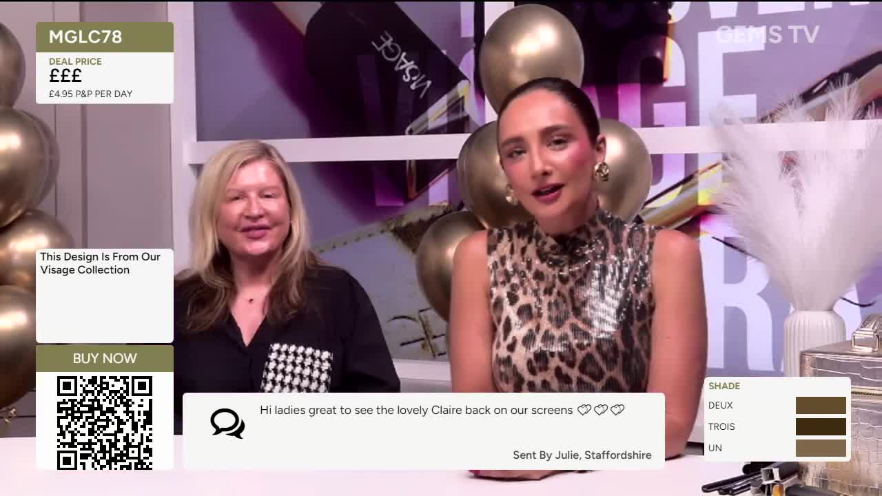 Two women are seated in front of a backdrop, one in a leopard-print top, the other in a black shirt with a checkered detail. A Gems TV logo is visible, and a chyron displays product details and a message from a viewer in Staffordshire.
