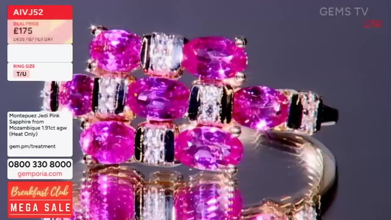 A close-up shot of a ring with bright pink gemstones is on display. The ring is being shown on a Gems TV broadcast, with information about the item displayed in the corner.
